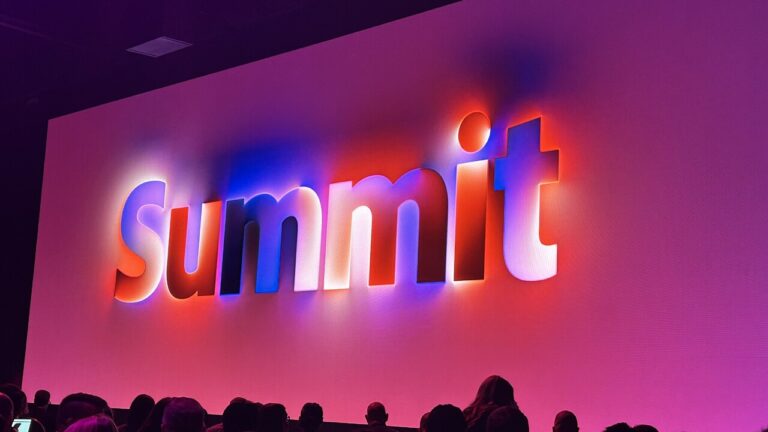A photo from Adobe 2024 Summit showing the Summit branding on stage.