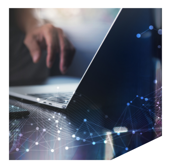 A man using a mobile phone and laptop, representing seamless data integration, deduplication, and connectivity for cleaner and more efficient marketing operations in Marketo Engage.